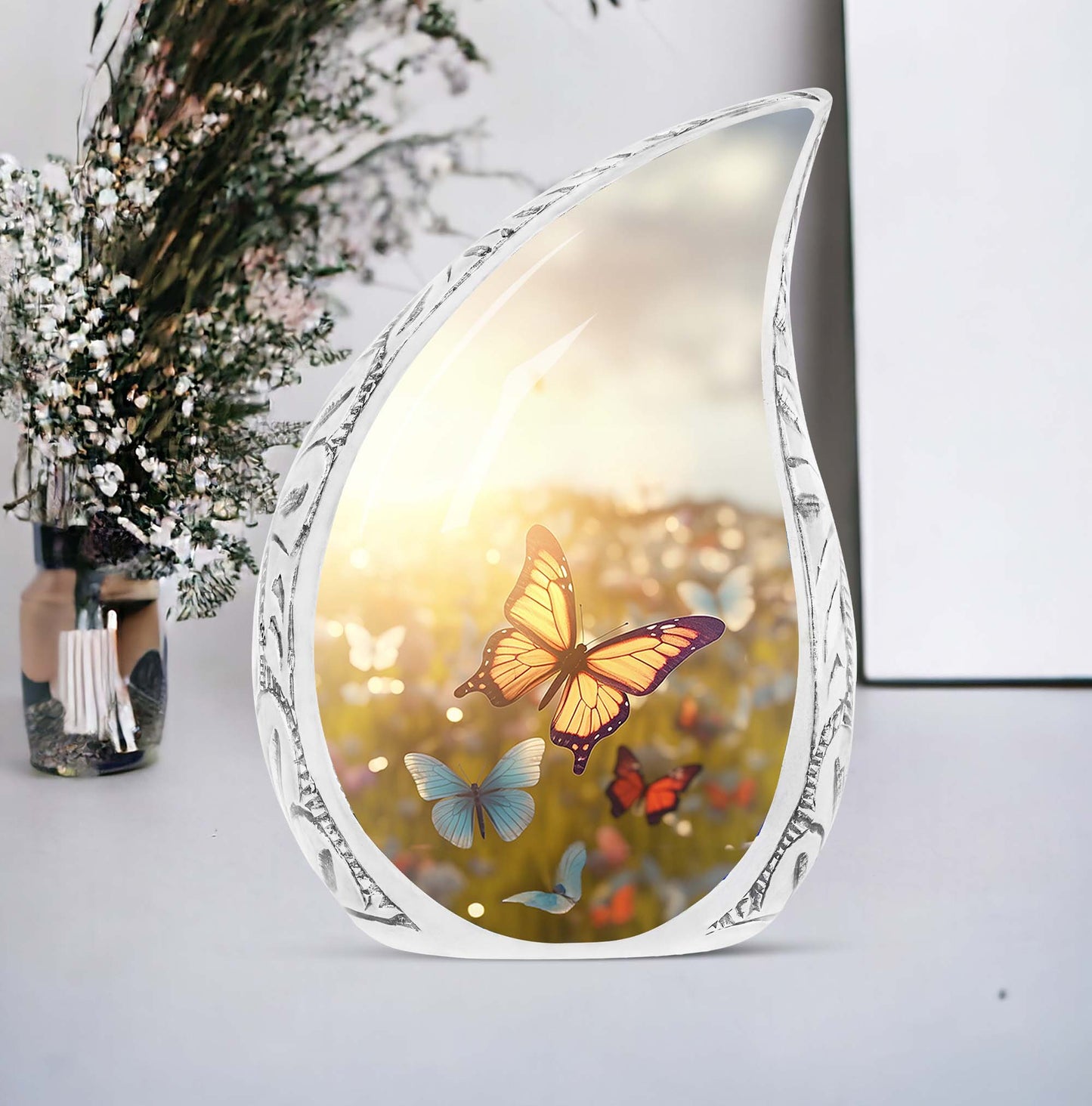 Large urn ornately designed with butterflies on a sunset meadow, ideal for human ashes adult female burial or cremation