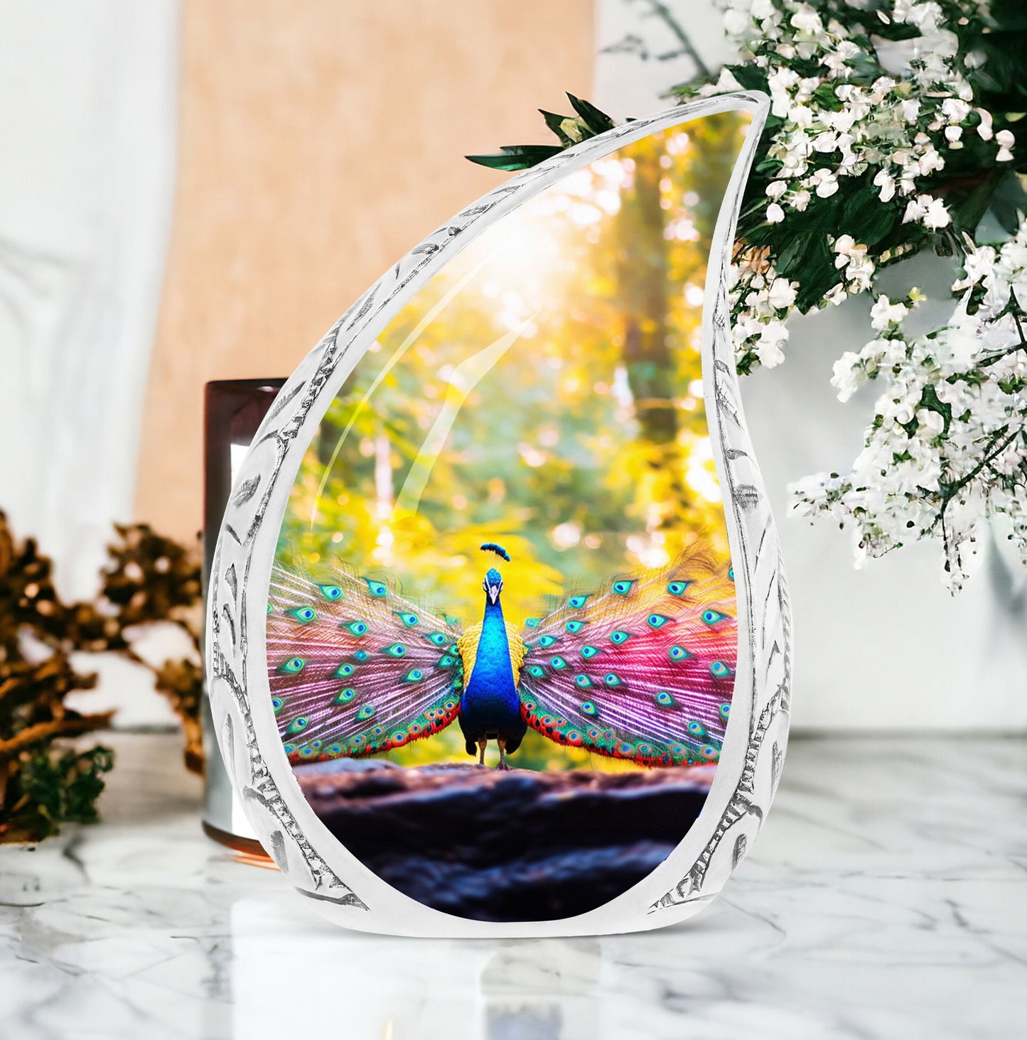 Large Peacock Urn for ashes showcasing its vibrant feathers in a garden setting, designed for adult human burial.