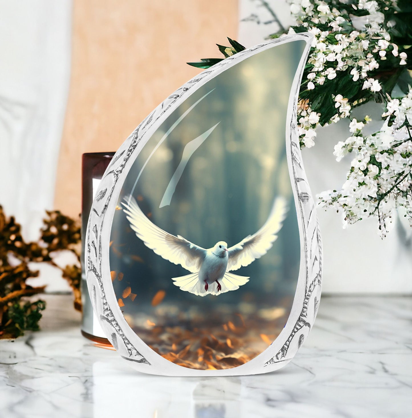 Large Dove Urn adorned with imagery of a dove in flight amidst fallen leaves, a suitable ashes holder for adult human ashes