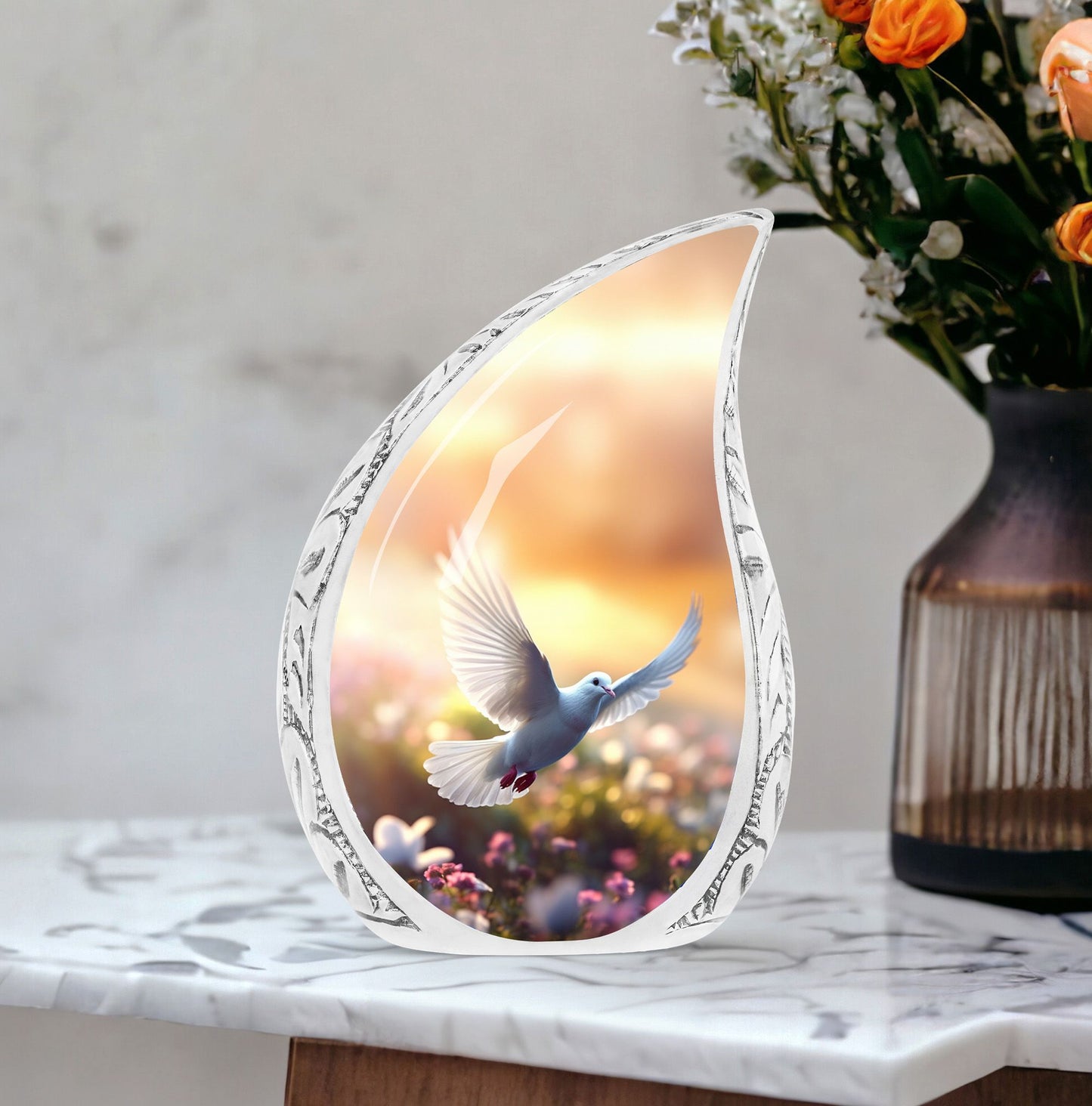 Large Dove-themed cremation urn with dove flying near flowers, a sophisticated urn choice for human ashes