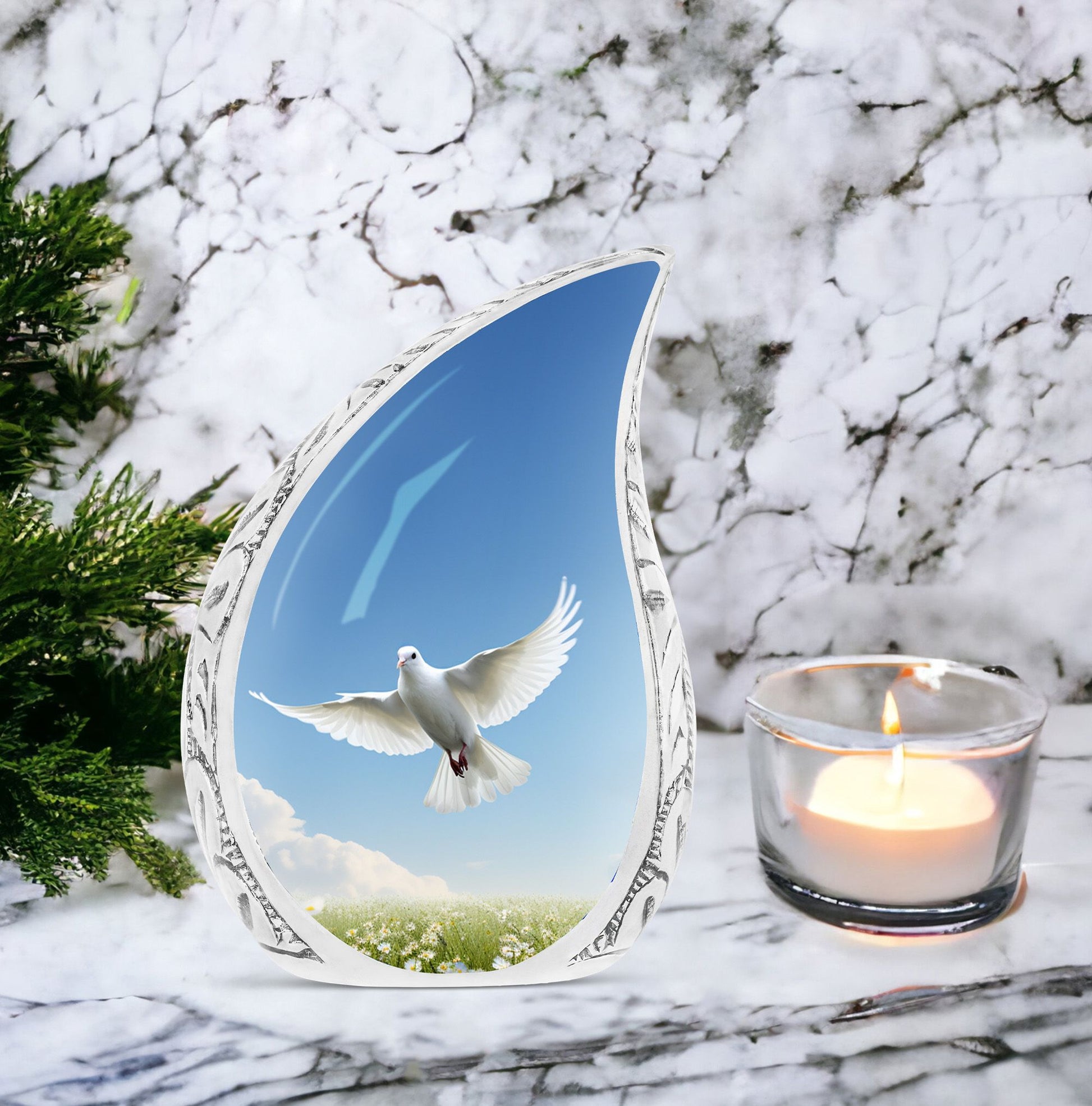 Large metal Dove urn placed in garden setting, designed for adult male human ashes