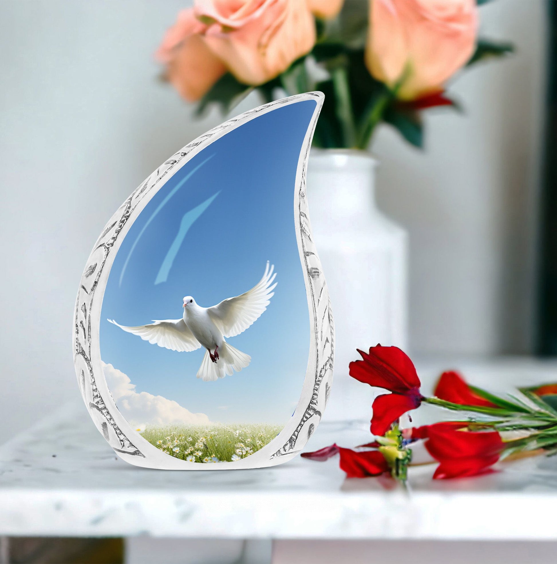 Large metal Dove urn placed in garden setting, designed for adult male human ashes