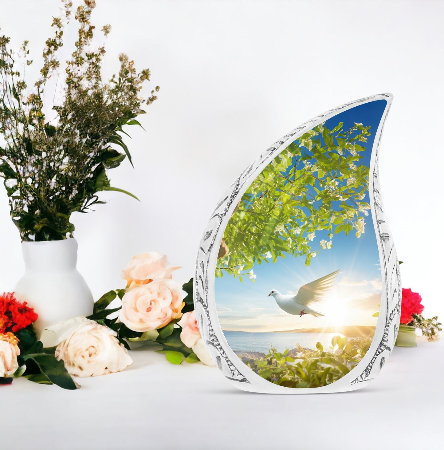 Large dove urn designed with a dove flying close to a tree, a unique cremation urn for women and a distinctive mosaic urn for human ashes