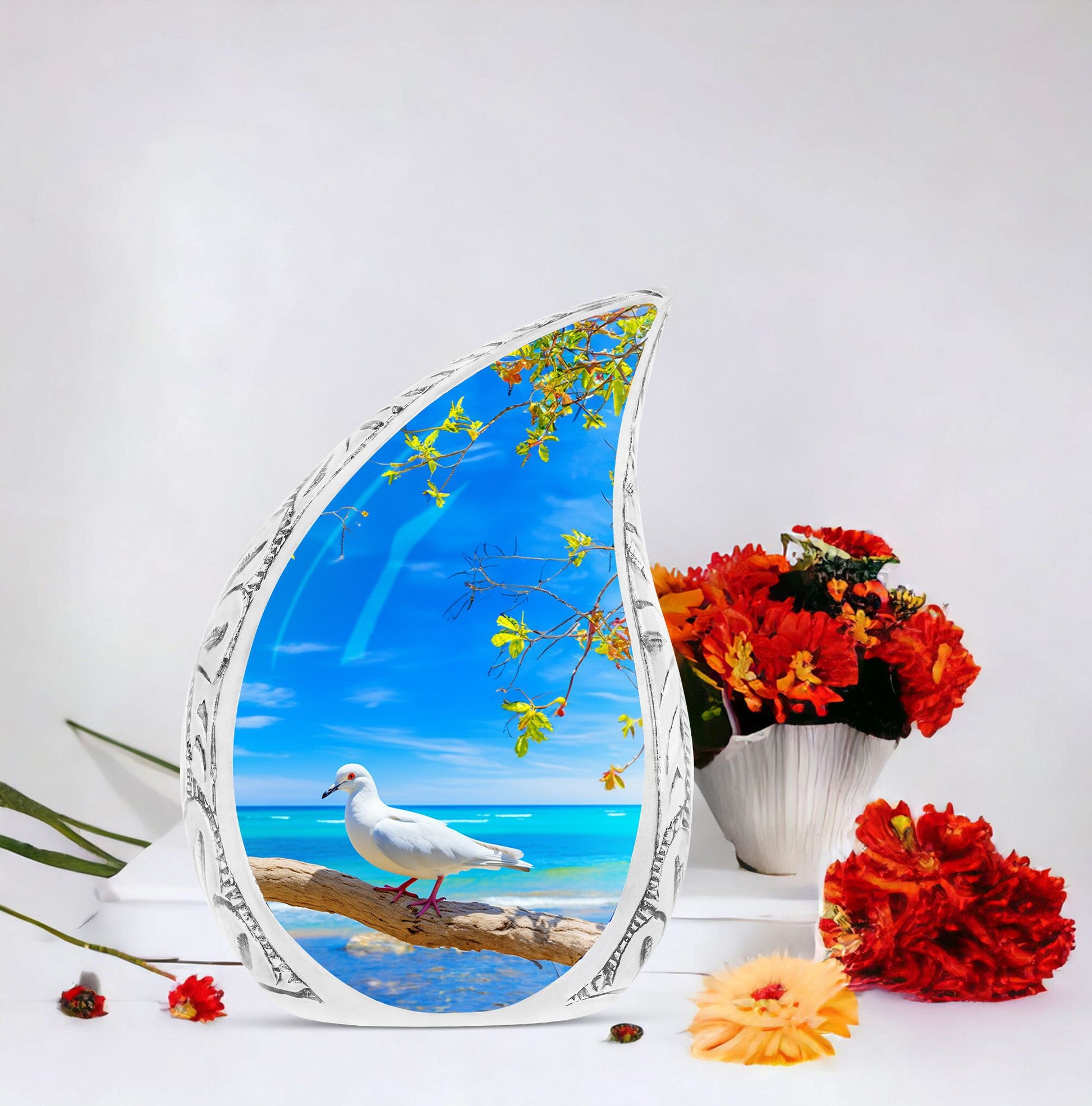 Large Dove Urn set against the backdrop of tree and ocean, unique burial urn for adult human ashes