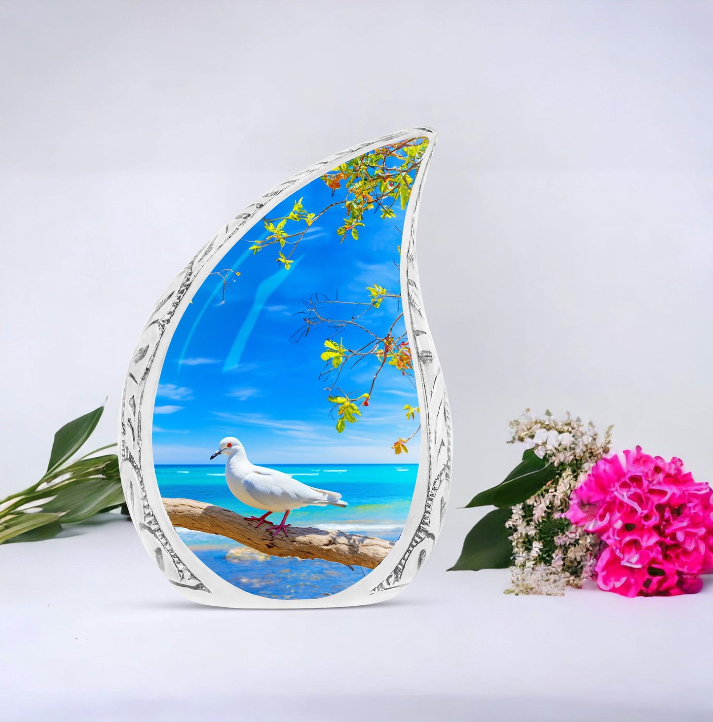 Large Dove Urn set against the backdrop of tree and ocean, unique burial urn for adult human ashes