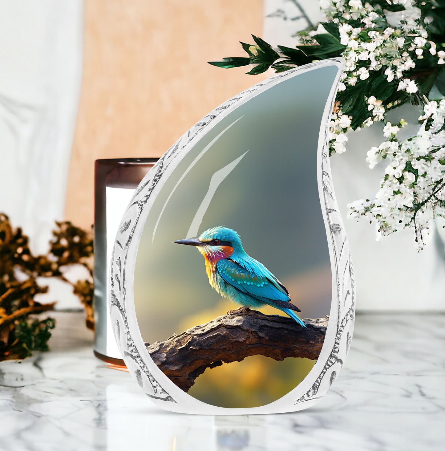 Large metal cremation urn with a green sparrow perched on a branch design, suitable for women's burial ashes