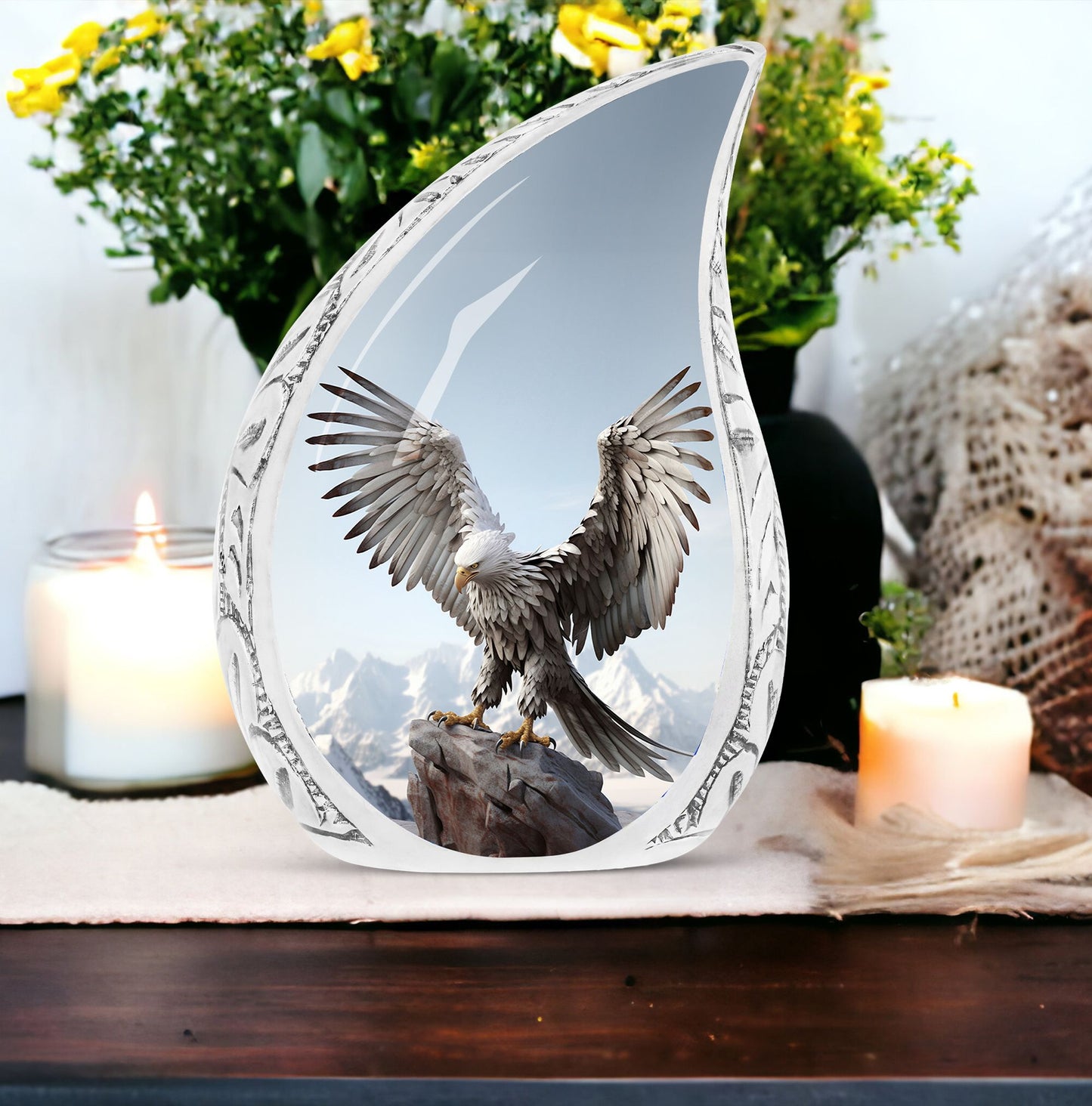 Large eagle urn in a serene snow mountain setting, designed for human ashes storage