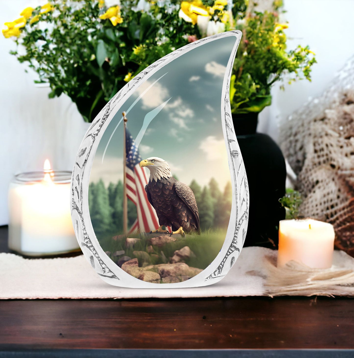 Large urn for human ashes depicting a striking eagle perched on a grassy hilltop