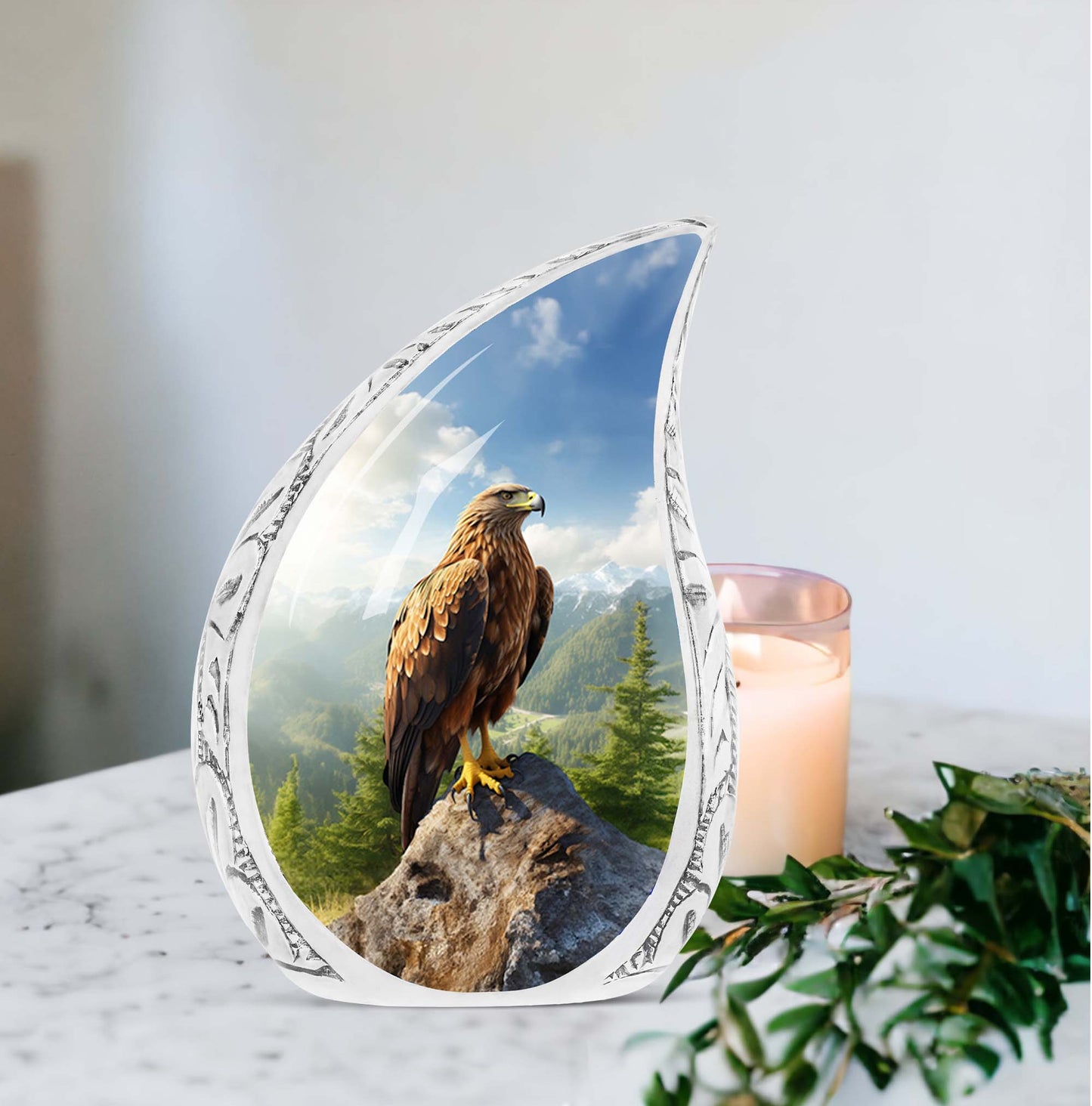 Portrait of an eagle perched on a large, stone urn designed for adult human ashes