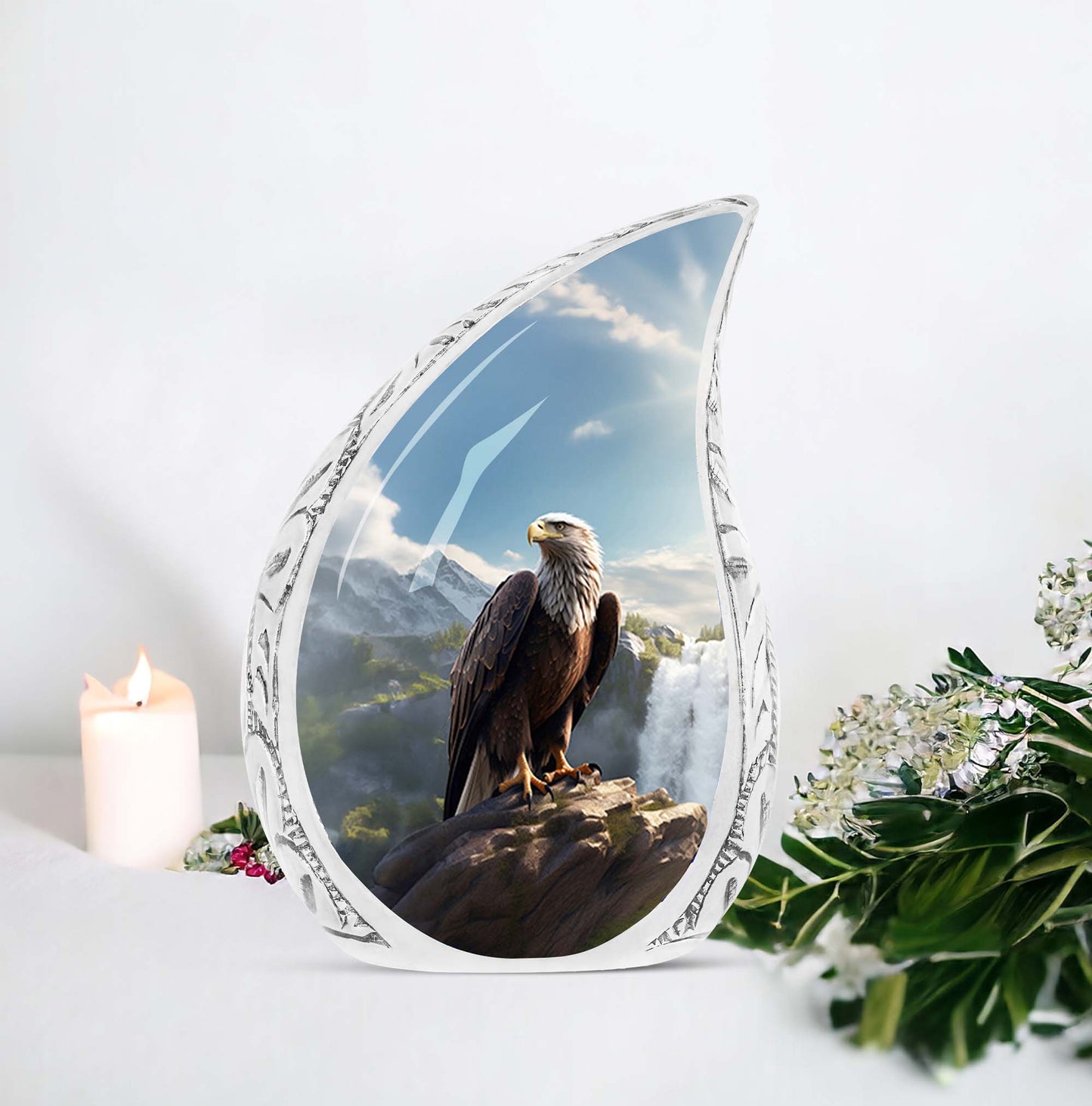 Large eagle-themed urn for human ashes, sitting by a waterfall, made of decorative metal