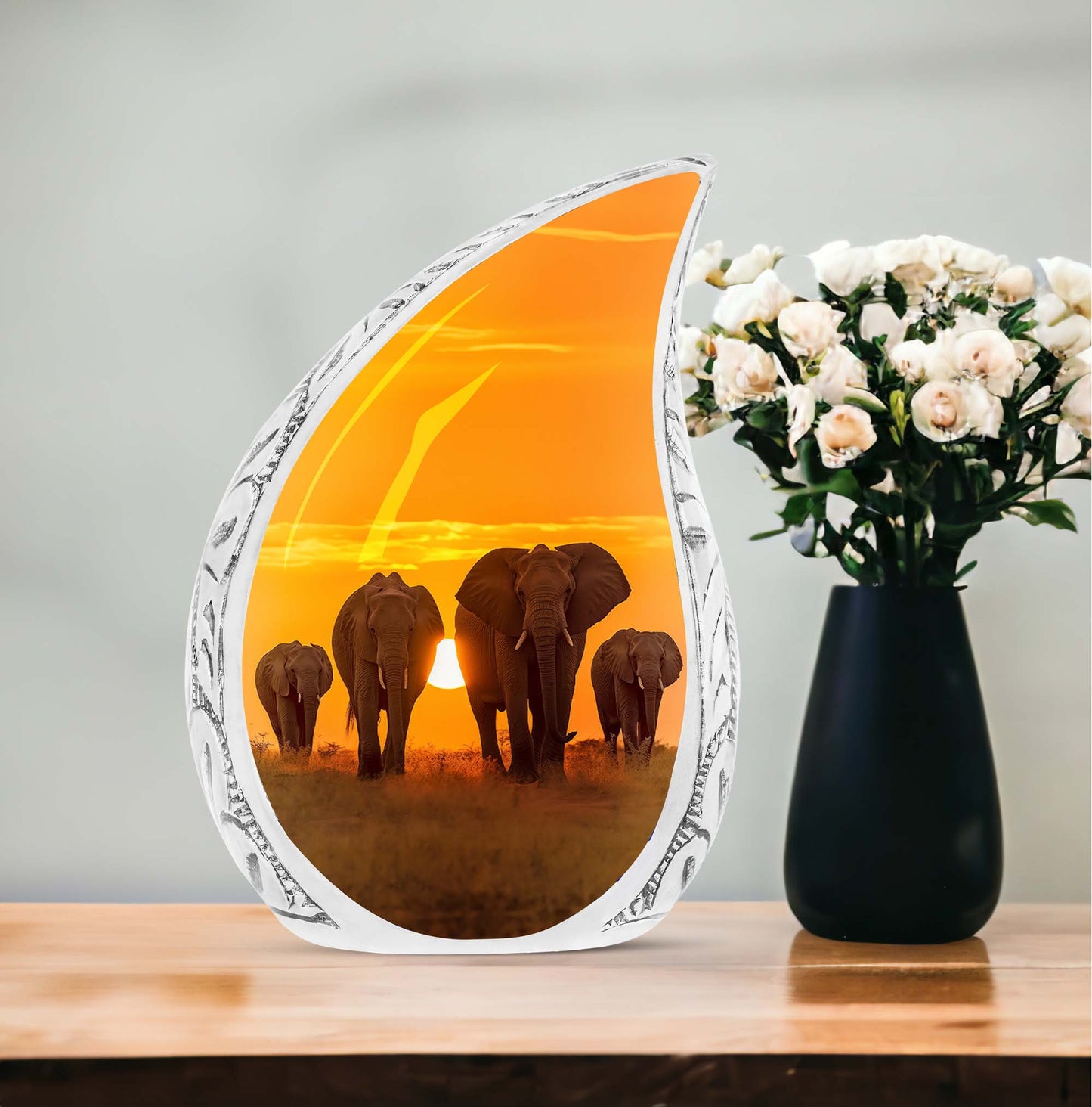 Large custom urn for human ashes featuring elephants taking a stroll during sunset, suitable for burial