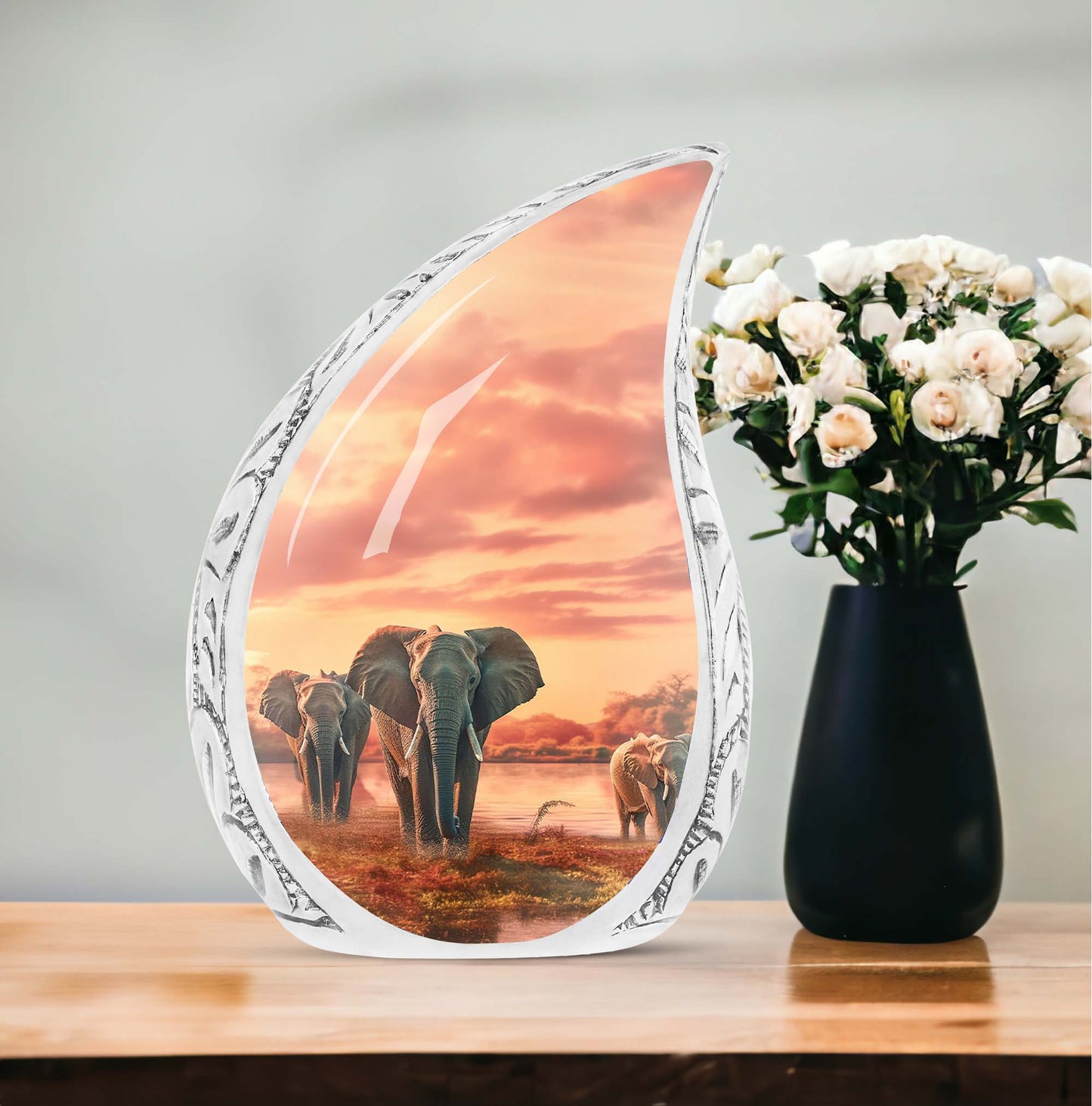 Large urn for human ashes featuring an elephant walking through a field design, suitable for funeral usage