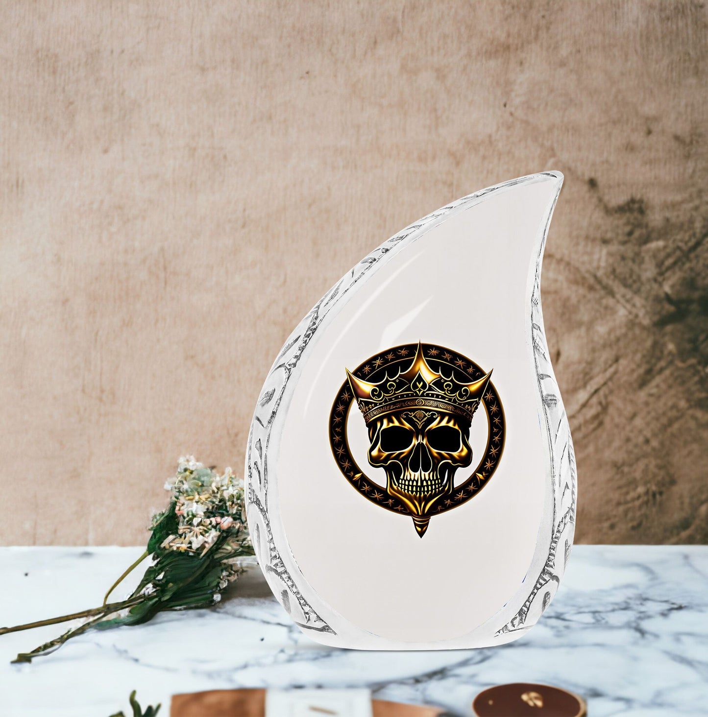 Large metal burial urn for adult ashes featuring a gold crown on a skull design, suitable for men
