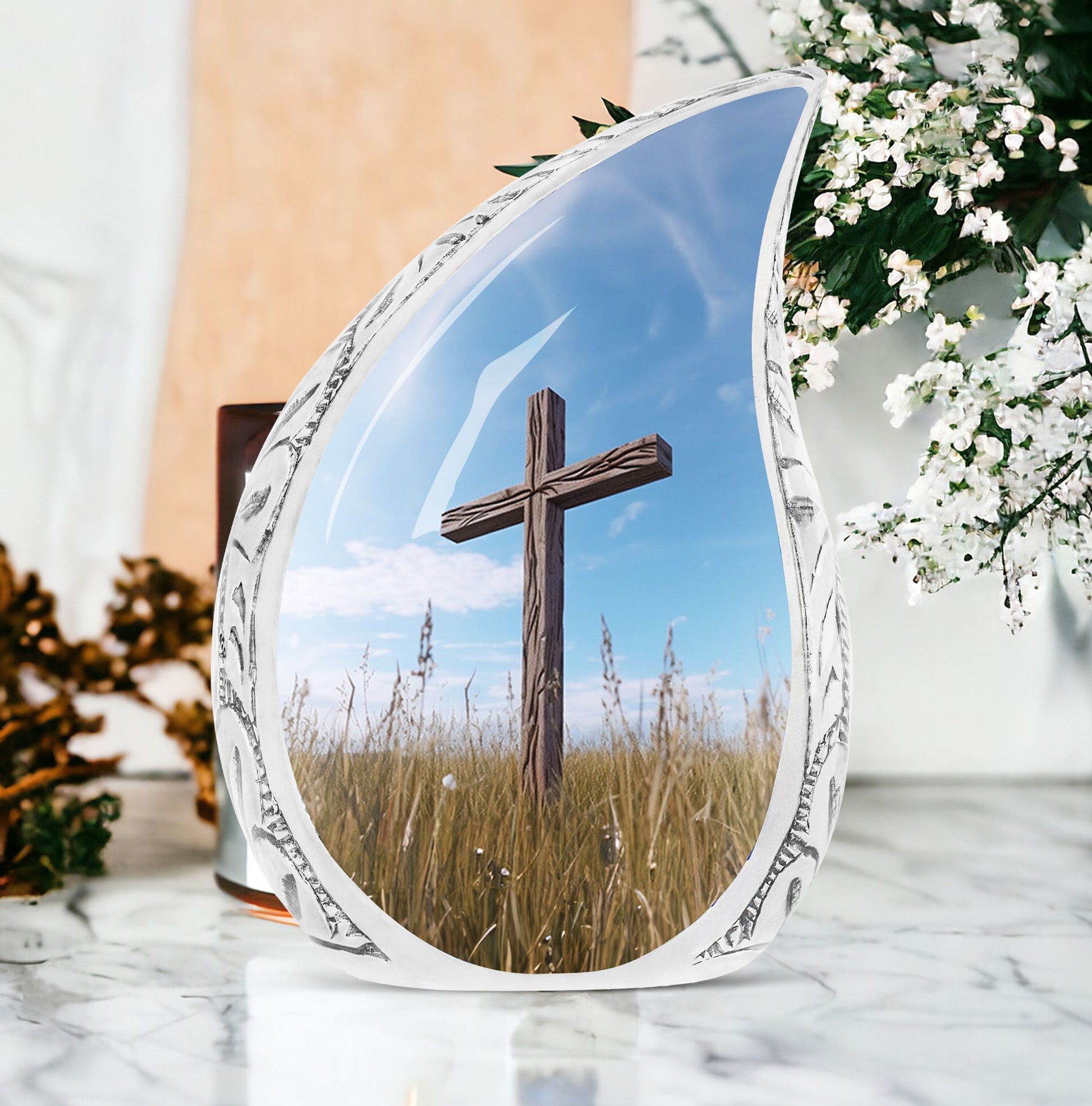 Large Christ Urns for human ashes, suitable for burial in ground under blue sky