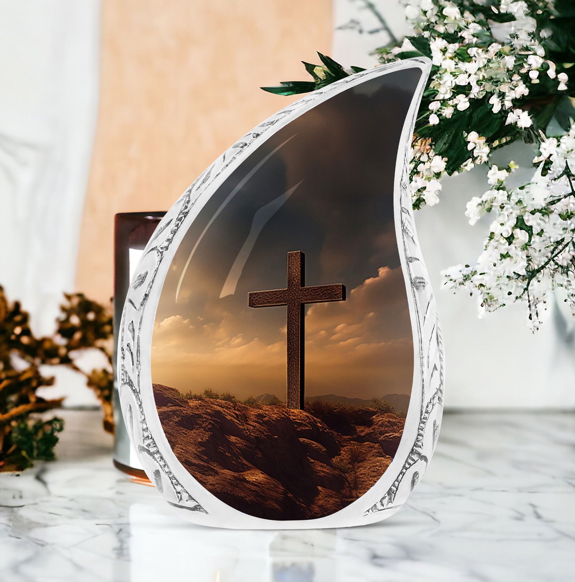 Large Christ themed urns for human ashes against a sunset sky, appropriate for funeral decorations.