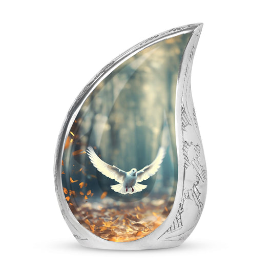 Large Dove Urn adorned with imagery of a dove in flight amidst fallen leaves, a suitable ashes holder for adult human ashes