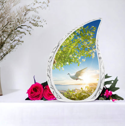 Large dove urn designed with a dove flying close to a tree, a unique cremation urn for women and a distinctive mosaic urn for human ashes