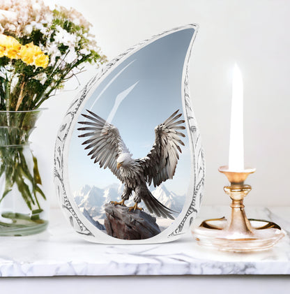 Large eagle urn in a serene snow mountain setting, designed for human ashes storage