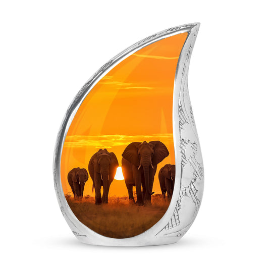 Large custom urn for human ashes featuring elephants taking a stroll during sunset, suitable for burial