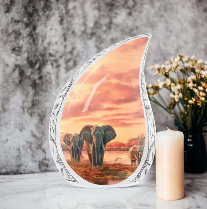 Large urn for human ashes featuring an elephant walking through a field design, suitable for funeral usage