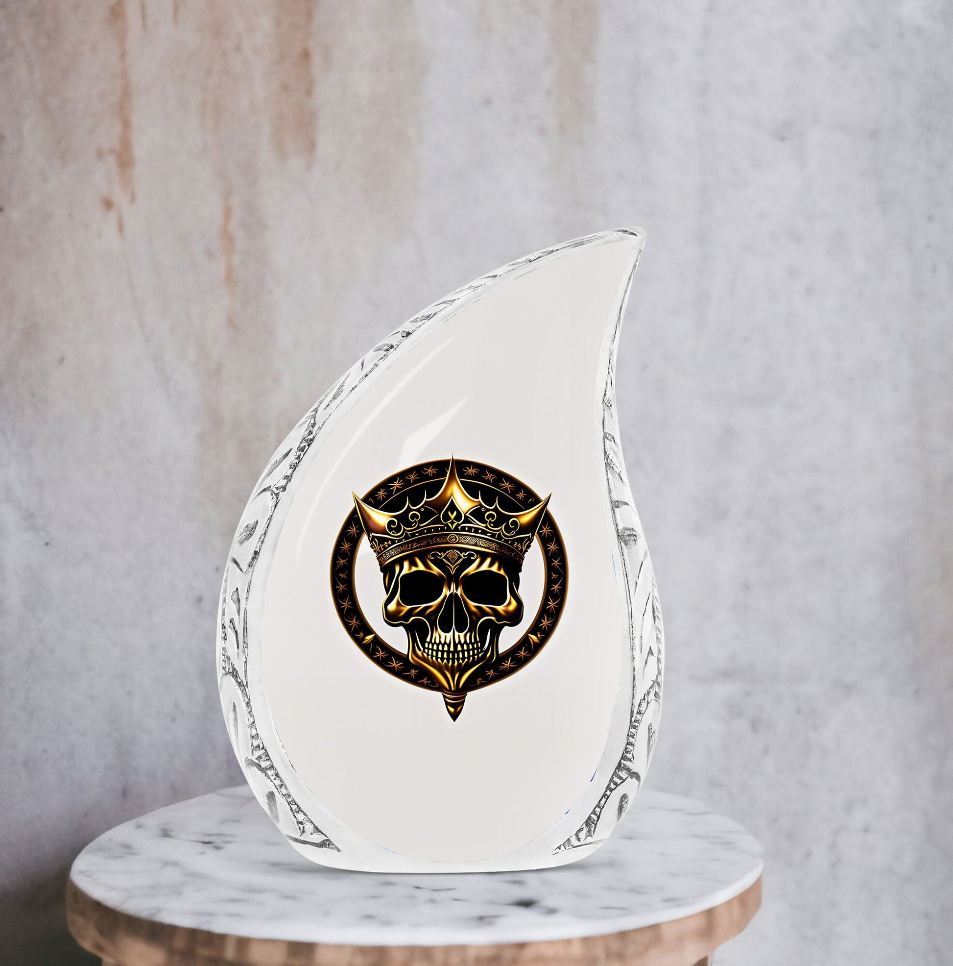 Large metal burial urn for adult ashes featuring a gold crown on a skull design, suitable for men