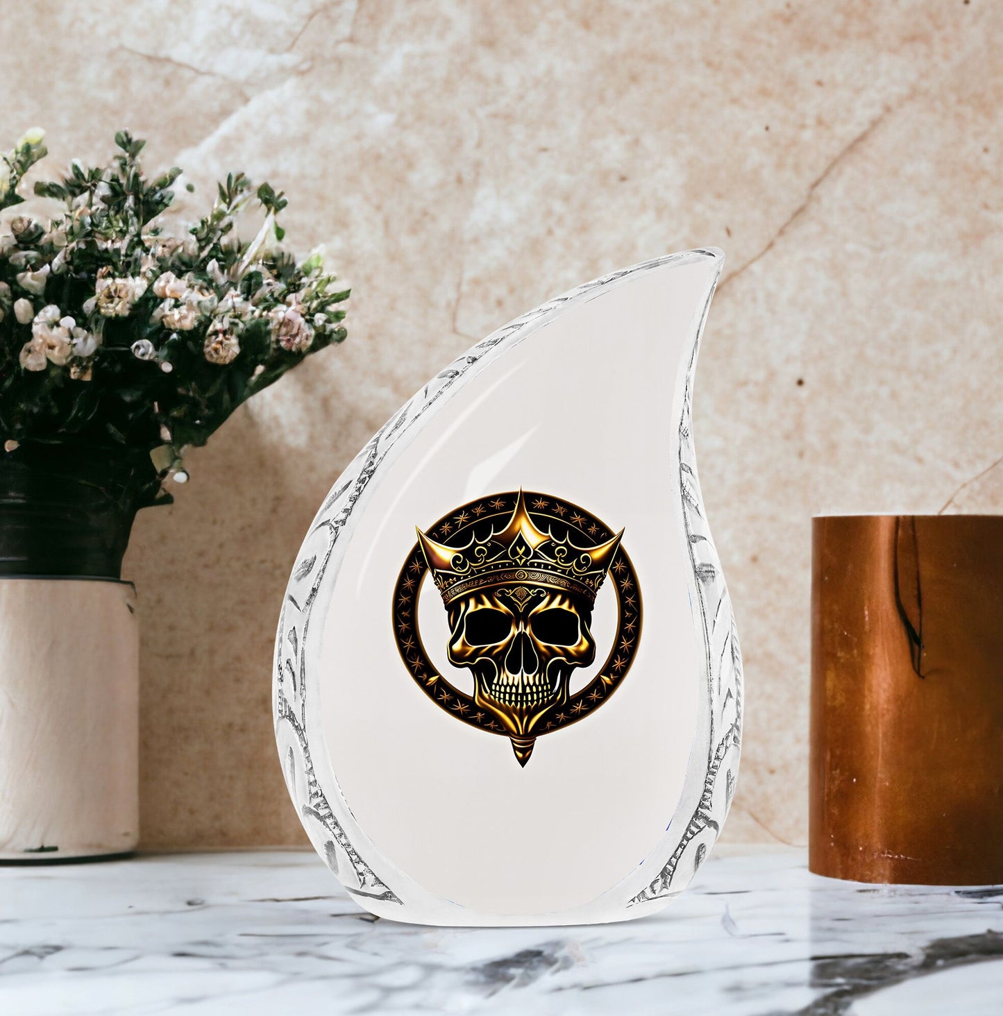 Large metal burial urn for adult ashes featuring a gold crown on a skull design, suitable for men