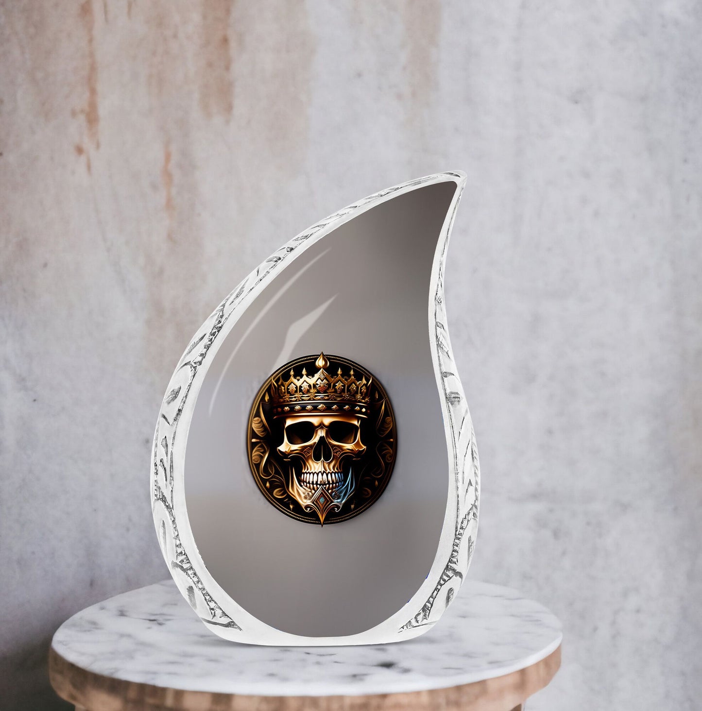 Large metal cremation urn for adults, featuring a skull with a crown design