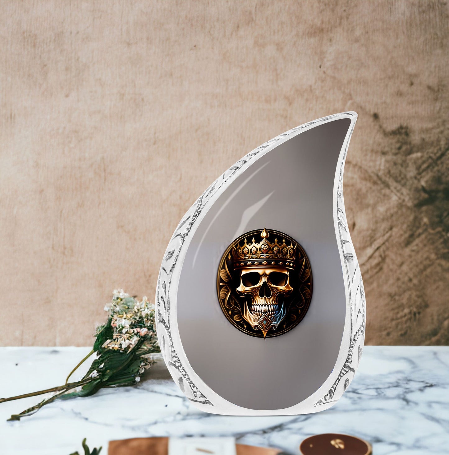 Large metal cremation urn for adults, featuring a skull with a crown design